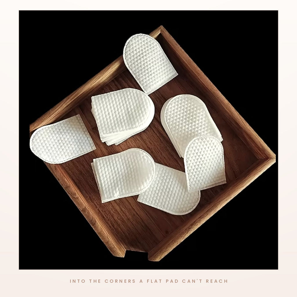 A cleansing mitt on a finger, lifting make-up