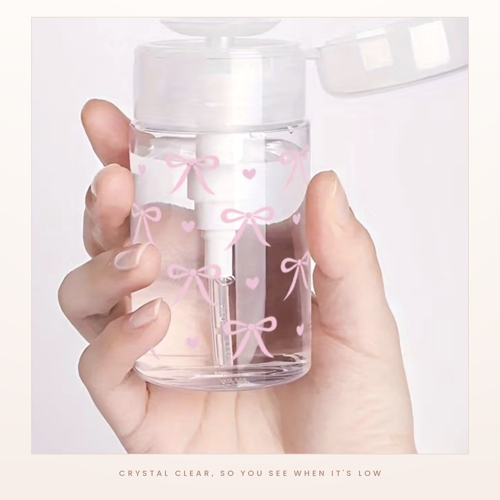 The clear bow print dispenser held in one hand